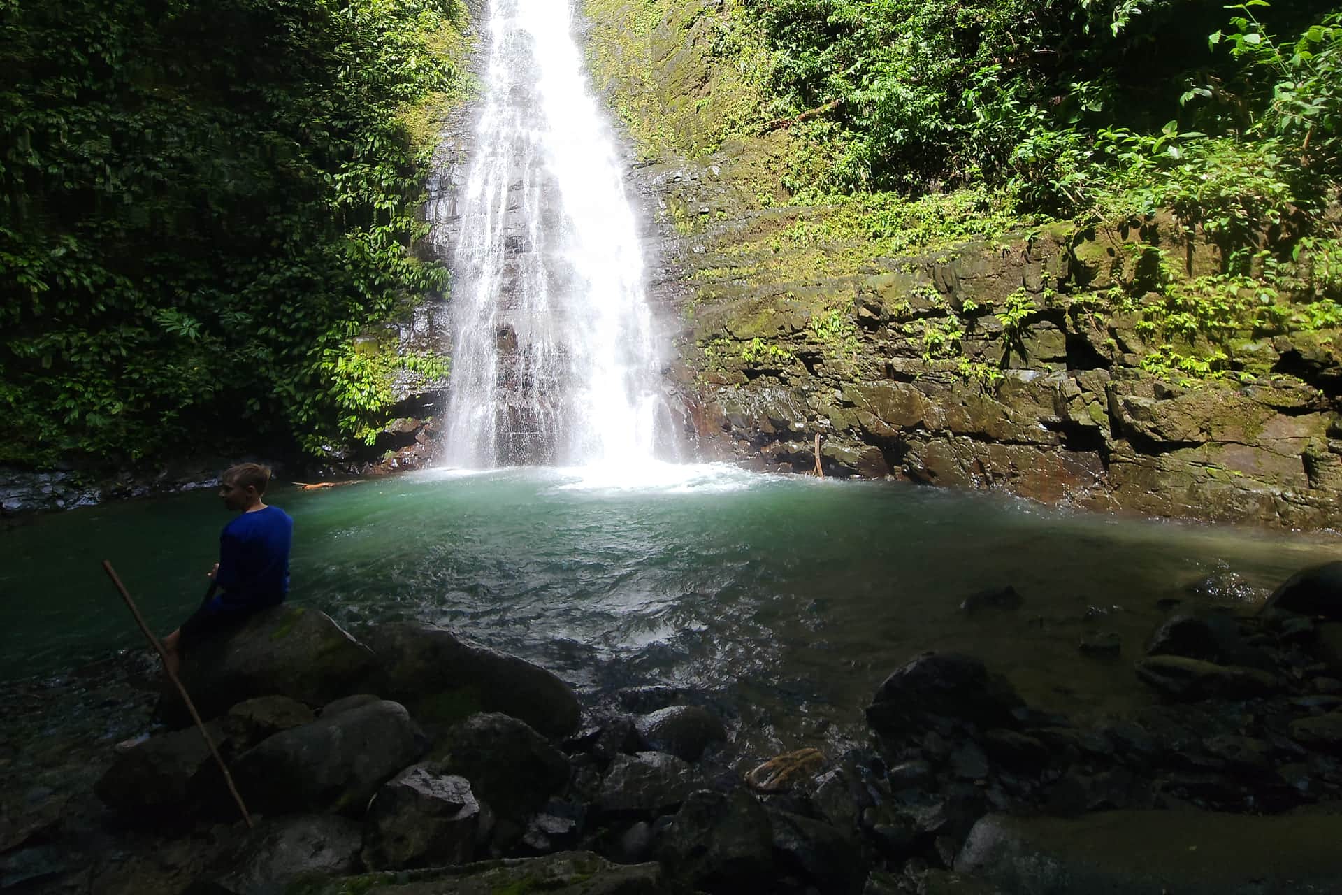 Scenic waterfall in lush rainforest at Santa Lucía Falls, Uvita, Costa Rica